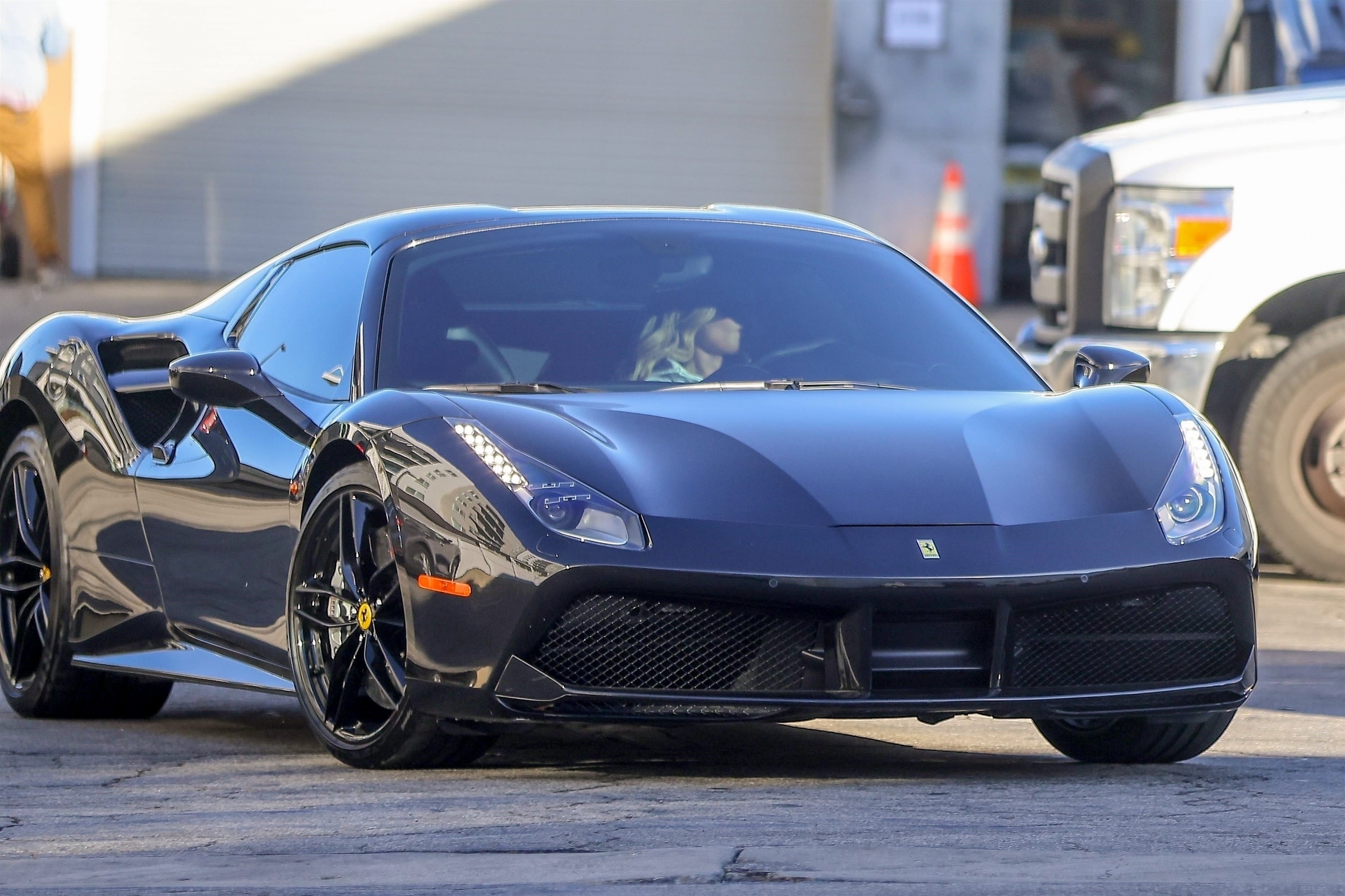 The Kardashian showed off in a pricey Ferrari