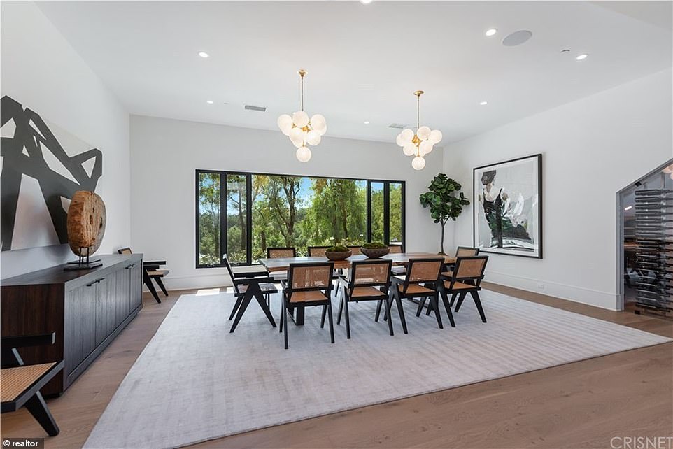 Formally: For fancy times there is formal dining room with glass-encased refrigerated wine storage at hand