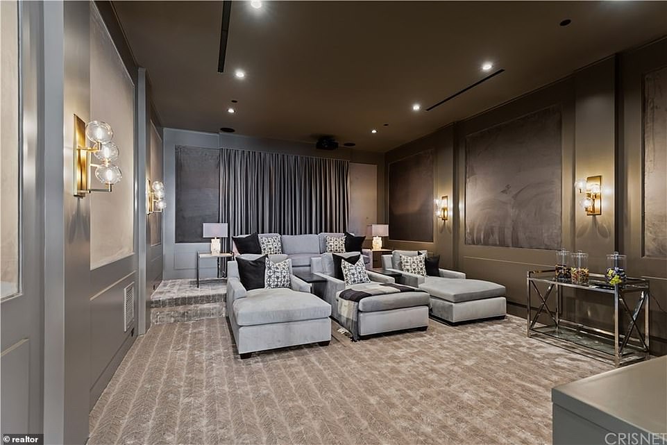 Screen time: Movie buffs can hang out in a custom-built home theater with upholstered velvet walls