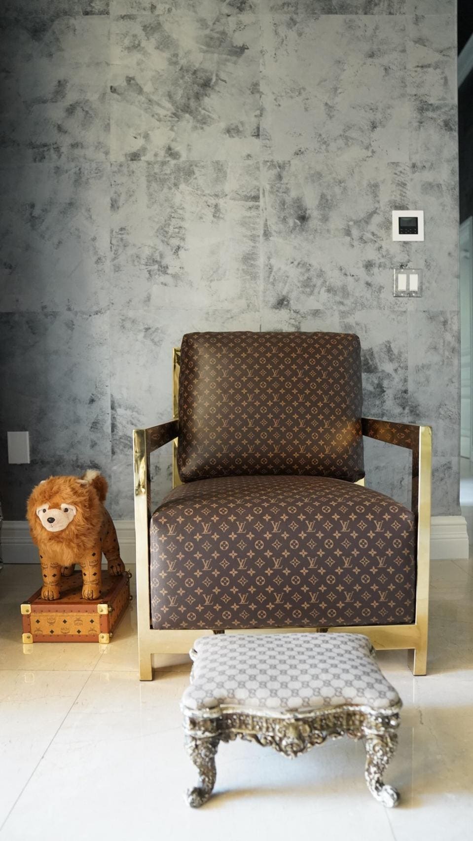 A  Louis Vuitton chair sits at Rick Ross' Florida home. 