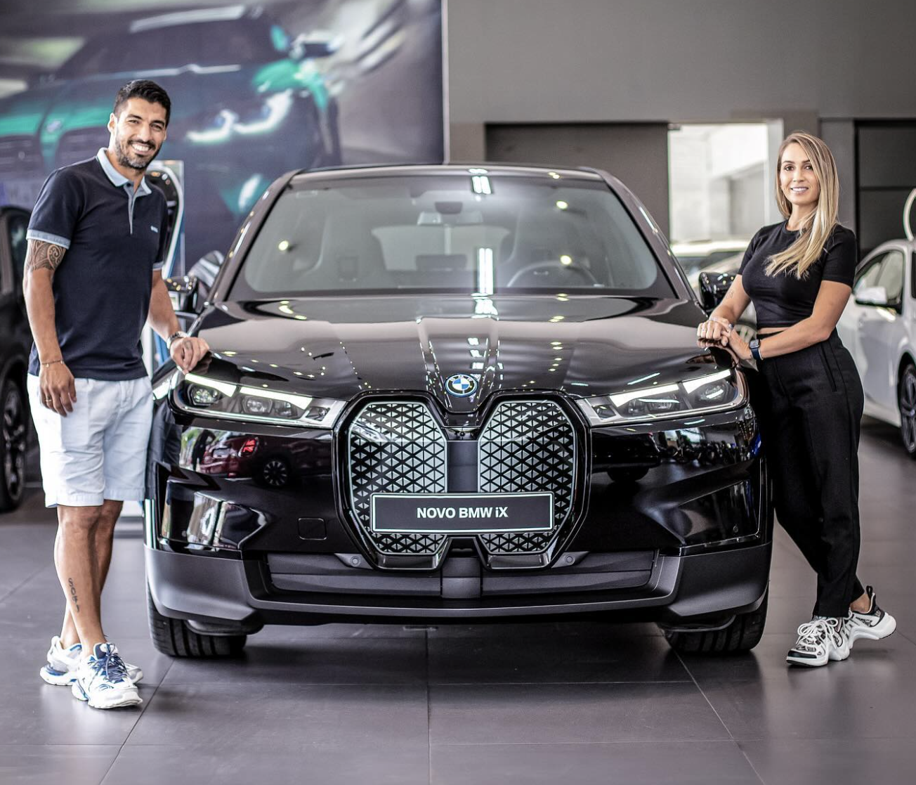 While in Brazil, Suarez and his stunning wife Sofia opted for an all-electric BMW