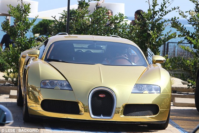 Lap of luxury: The multimillion-dollar ride was parked with the Pacific Ocean glistening in the background 