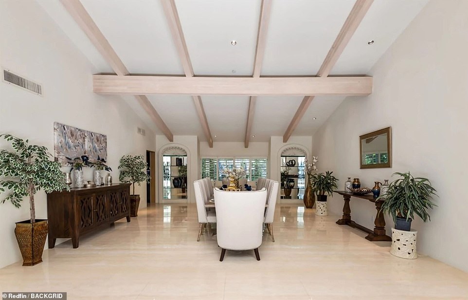 A formal dining room has plenty of space for a dinner party