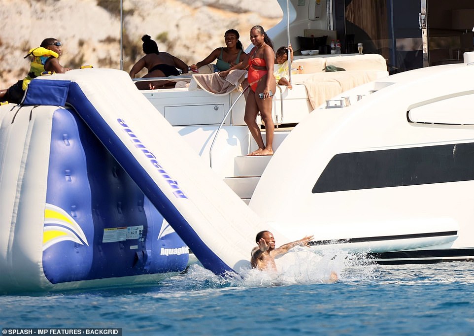 Going the distance: Paige watched on lovingly at her brood as they splashed around on the high seas