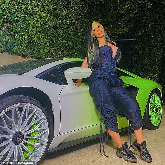 Cardi B wears a plunging blue corset and poses next to a Lamborghini |  Cardi b, Blue corset, Cardi